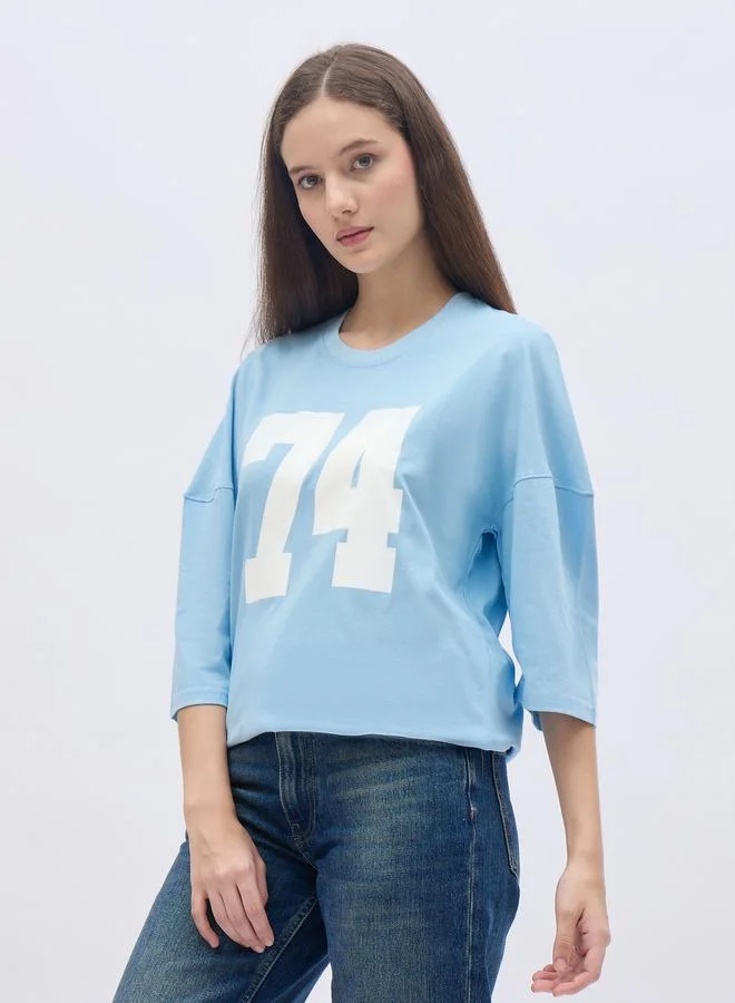 Styli Styli Women Light Blue Exaggerated Shoulder Graphic Oversized T-Shirt
