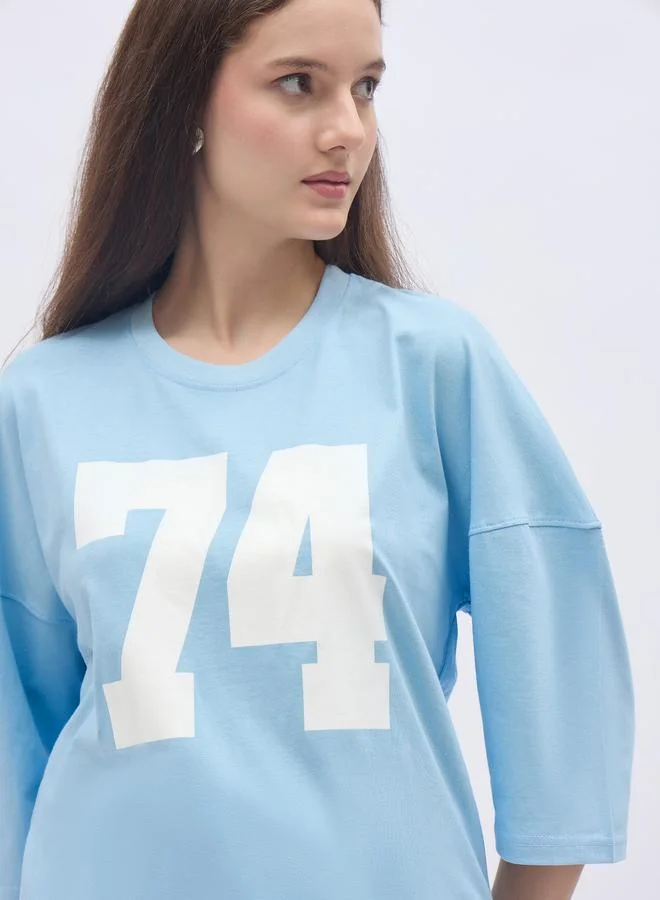 Styli Styli Women Light Blue Exaggerated Shoulder Graphic Oversized T-Shirt