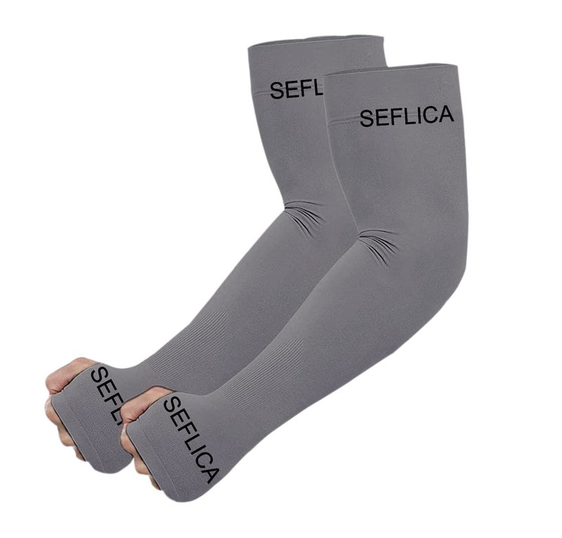 SEFLICA UV Sun Protection Cooling UPF 50 Compression Arm Sleeve for Men and Women With Thumb Hole, Arm Sleeves for Boys and Girls, For Tattoo Cover Up and Sports, 1 Pair - Grey - Image 1