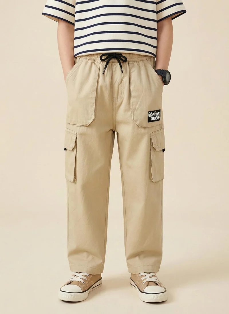 نوتيناتي Nautinati Boys’ 100% Cotton Regular Fit Solid  Woven Cargo Pants with Badge