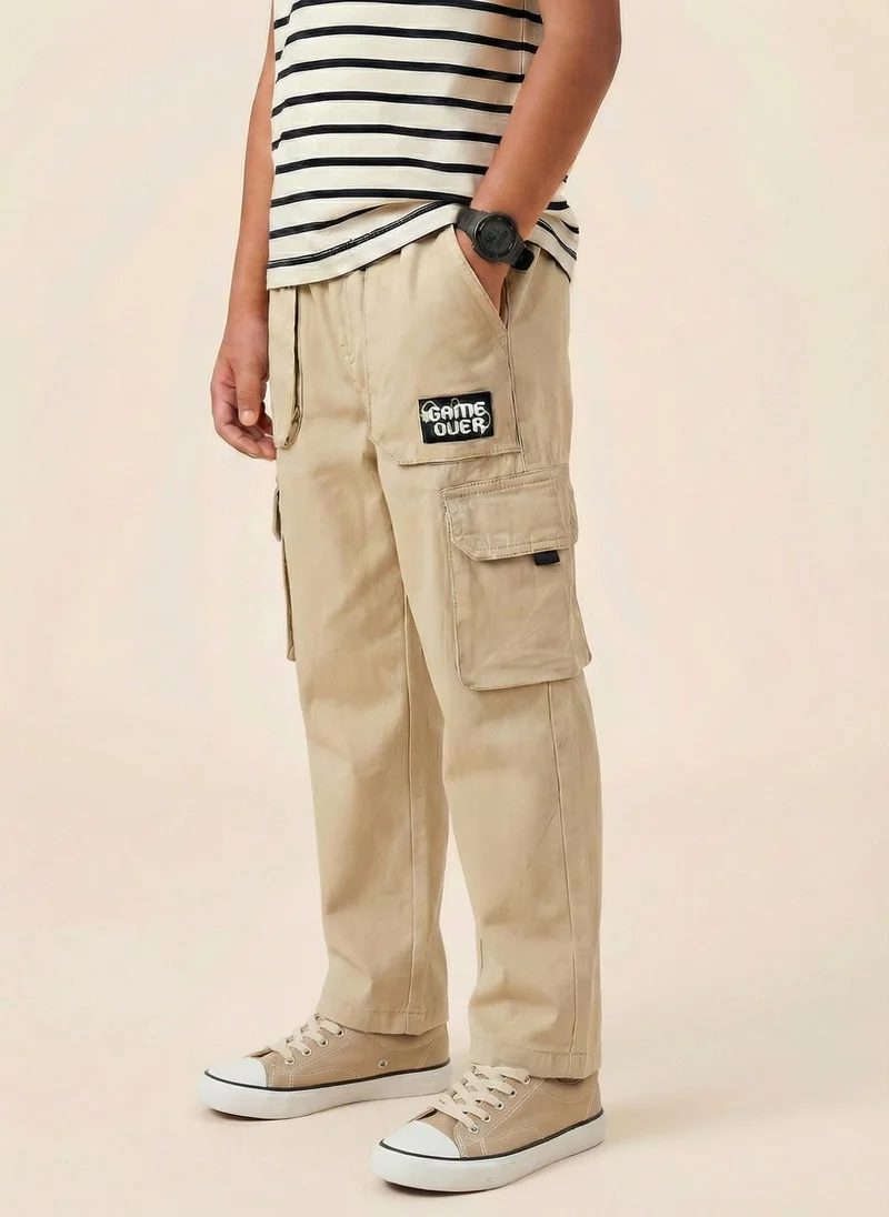 نوتيناتي Nautinati Boys’ 100% Cotton Regular Fit Solid  Woven Cargo Pants with Badge