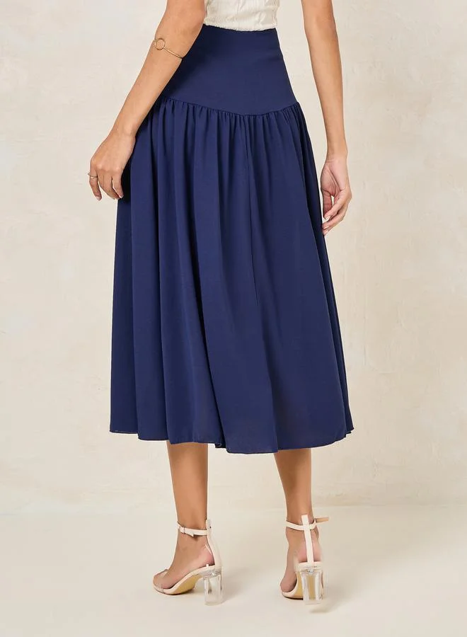 Styli Wide Waistband Plicated A-Line Midi Skirt