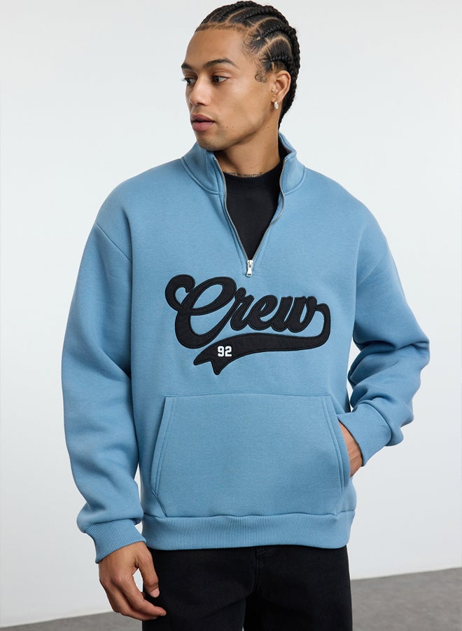 trendyol Blue Stand Collar Oversize/Wide Cut Stand Collar Zippered Text Embroidered Sweatshirt - Image 2