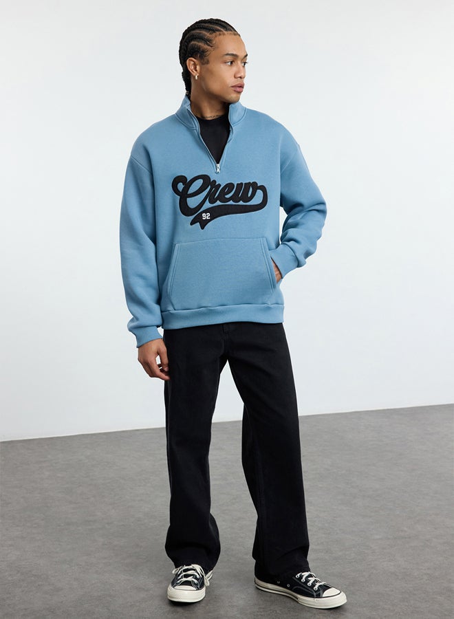 trendyol Blue Stand Collar Oversize/Wide Cut Stand Collar Zippered Text Embroidered Sweatshirt - Image 1