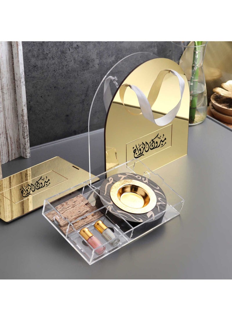 Story Of Candle An Incense Burner with Distinctive Arabic Engravings, a Luxurious Bag Made of White and Transparent Acrylic, a Box Containing Natural Oud Chips, and two Packages of a Quarter Tola of Luxurious Musk. - Image 1