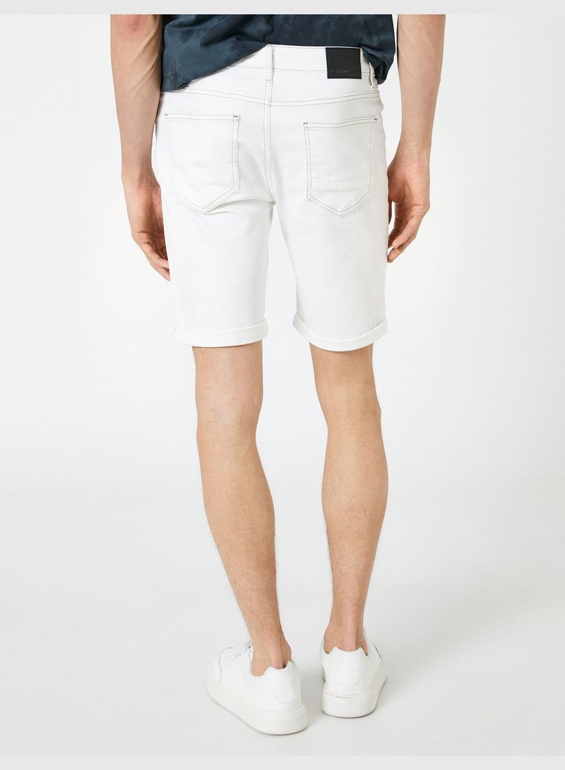 KOTON شورتات جينز بأرجل مطوية مزودة بأزرار وتفاصيل جيوب قطنية - Image 4