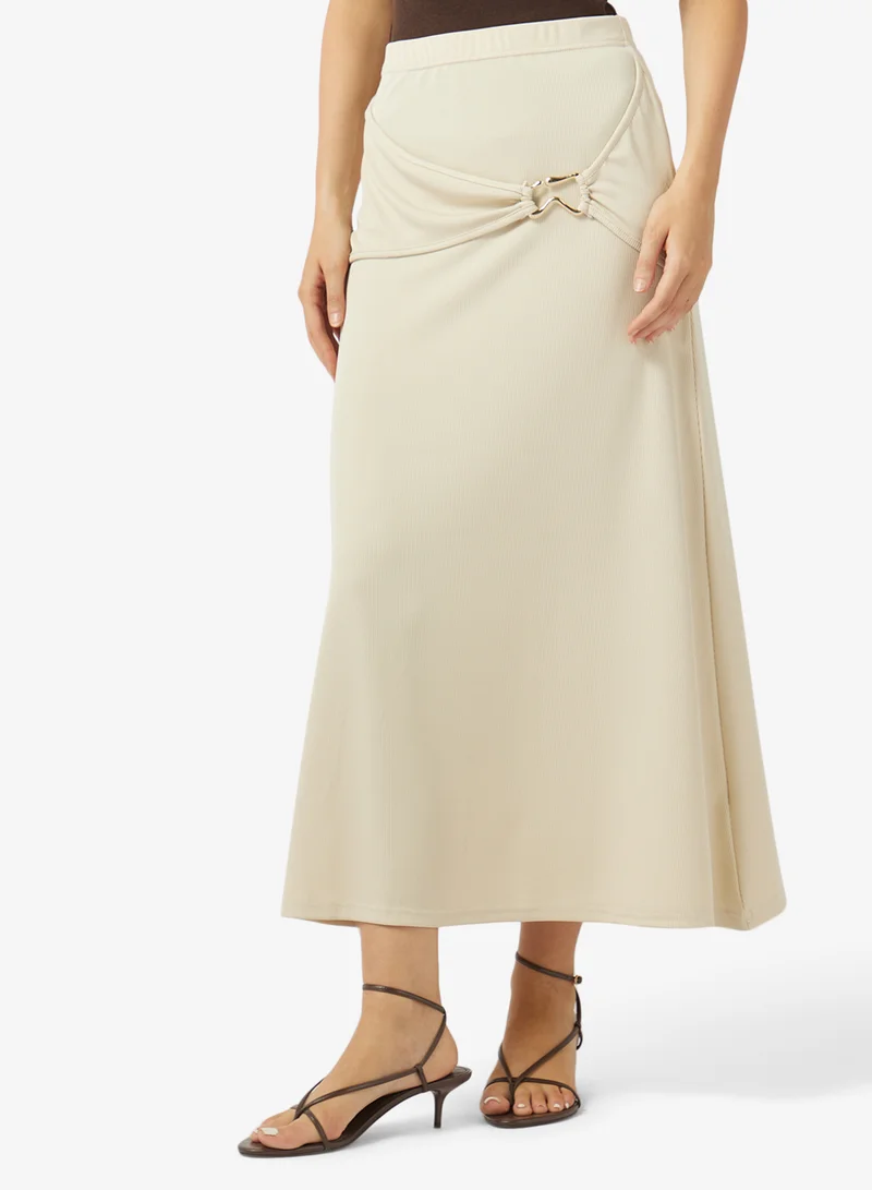 ايلا تنورة بحلقة معدنية