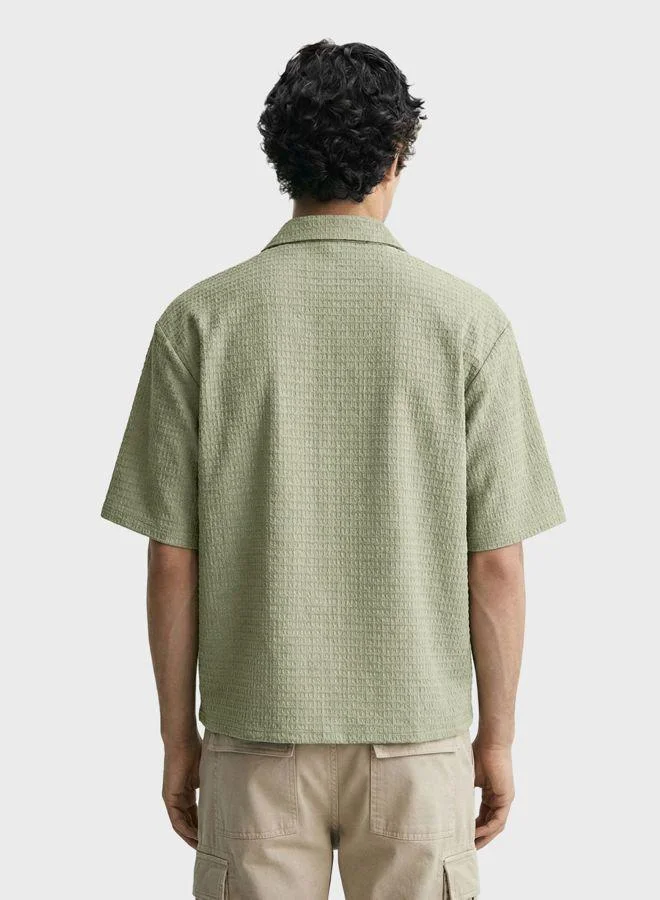 The Indian Garage Co Men Boxy Fit Textured Round Neck Half Sleeves Polo T-Shirt