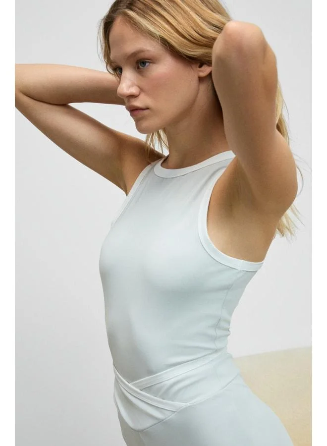 Urban Beat RUNTRA Women's Soft and Stretchy Textured Sporty Gray Sports Tank Top with Contrast Collar and Sleeve Trim.