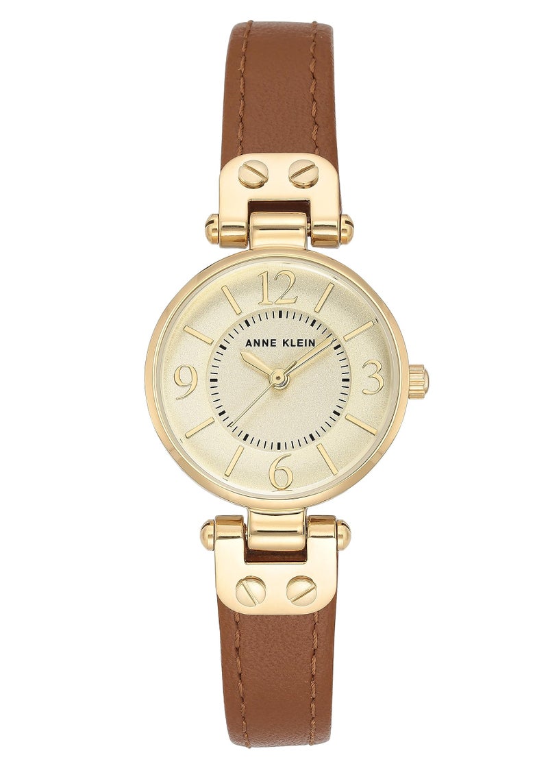 ANNE KLEIN ساعة آن كلاين للنساء 109442CHHY بقرص شامبانيا بلون ذهبي وحزام جلد بني - Image 1