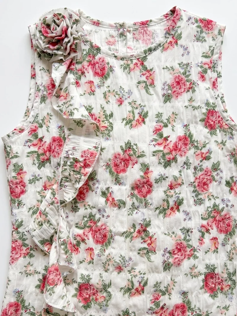 Outzidr  White Elegant Sleeveless Blouse With Ruffle And Corsage Detail for Women | Best Price UAE