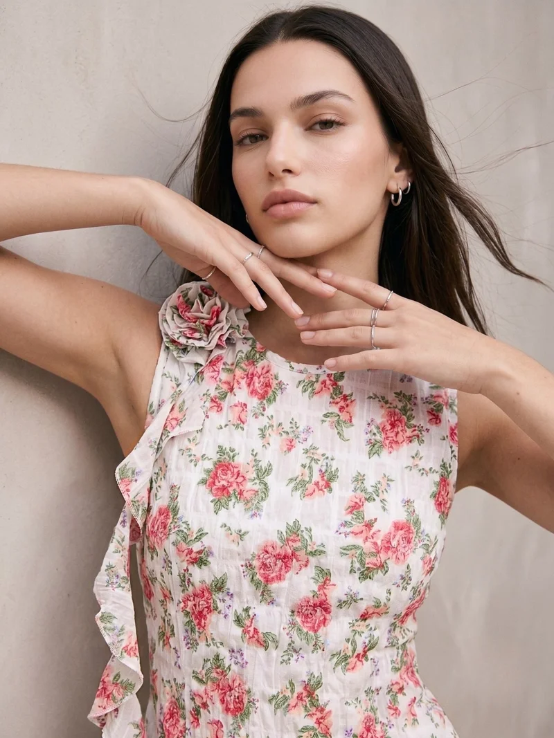White Elegant Sleeveless Blouse With Ruffle And Corsage Detail