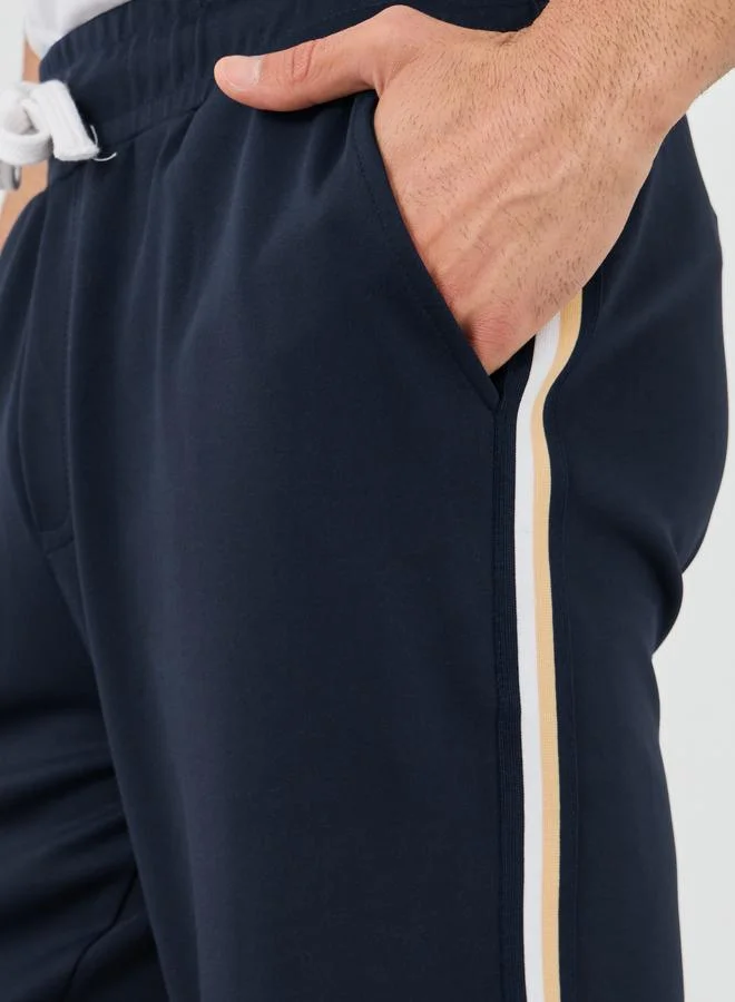 Styli Styli Mid Rise Relaxed Fit Joggers with Tape Detail