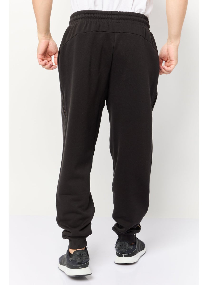 PUMA Men Sportswear Fit Brand Logo Outdoor Sweatpants, Black  - Image 4