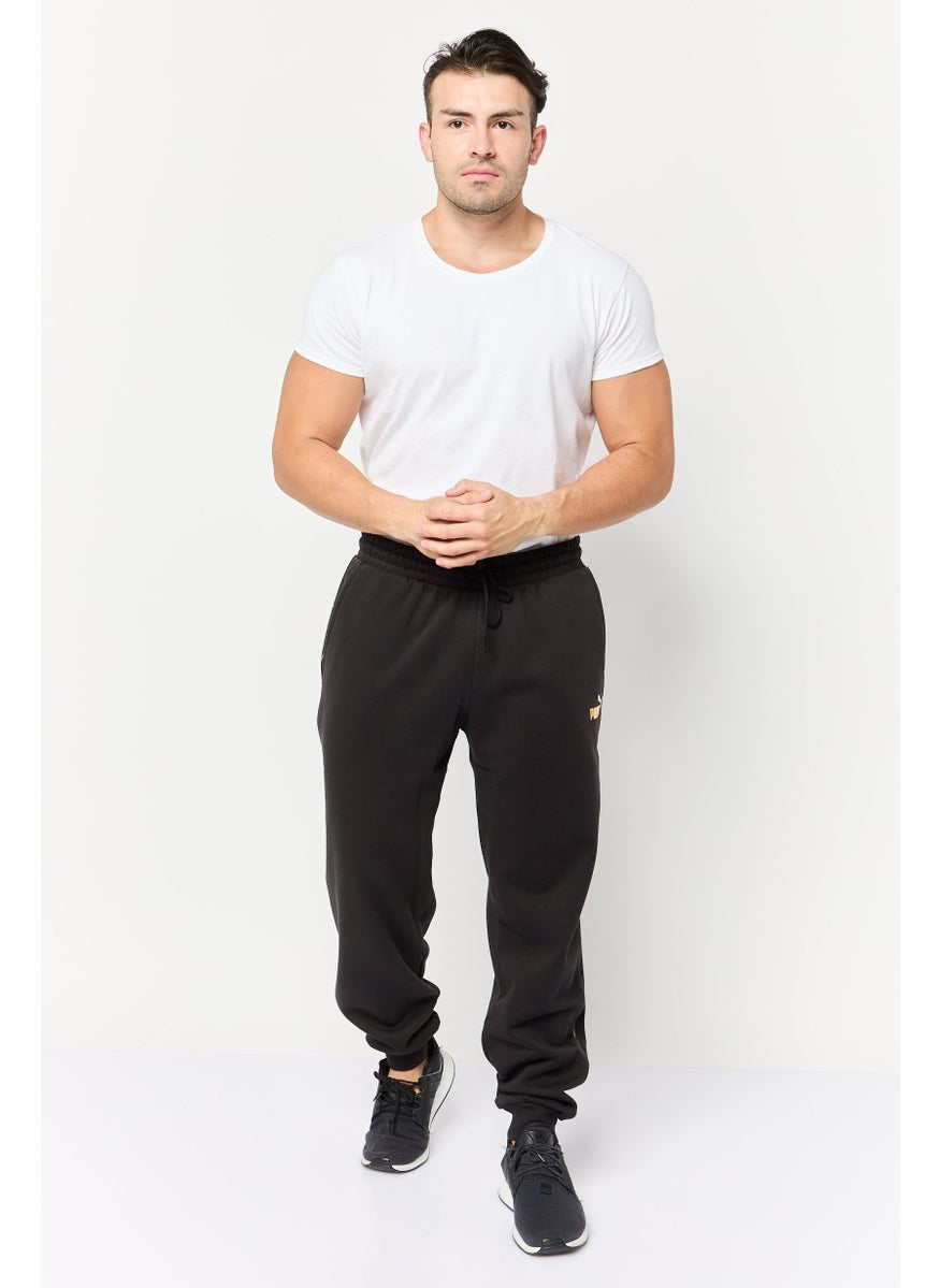PUMA Men Sportswear Fit Brand Logo Outdoor Sweatpants, Black  - Image 2