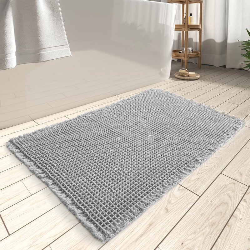 AMOAMI Upgraded Waffle Bath Mat  Super Absorbent Non Slip Bath Mats for Bathroom Floor  Machine Washable Bathroom Rugs with Tassels  Rubber Backed Bathroom Mats  Ultra Soft  18"" x 30""  Grey - Image 1