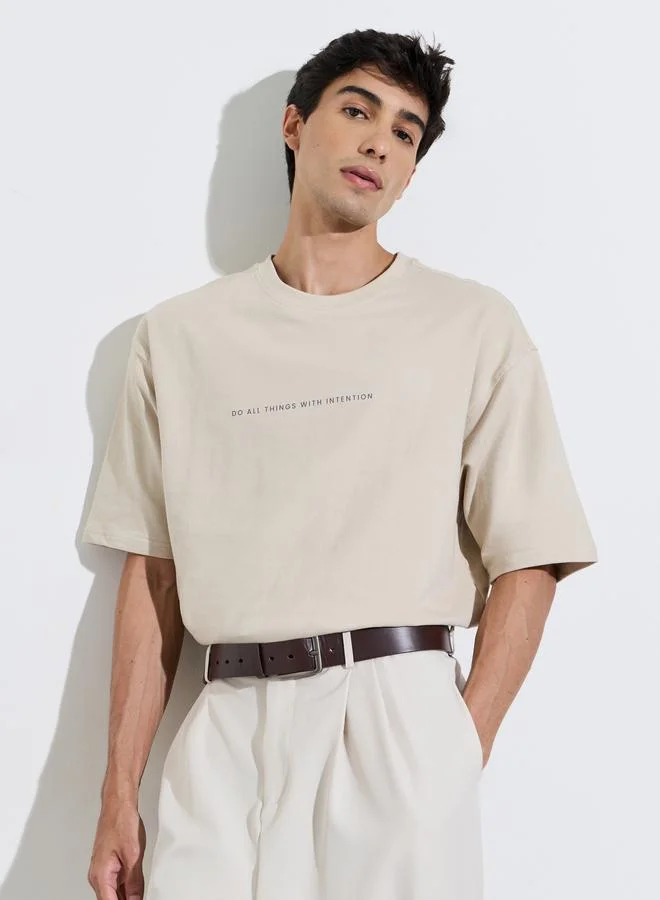 Styli Beige Graphic Print Crew Neck Oversized T-Shirt
