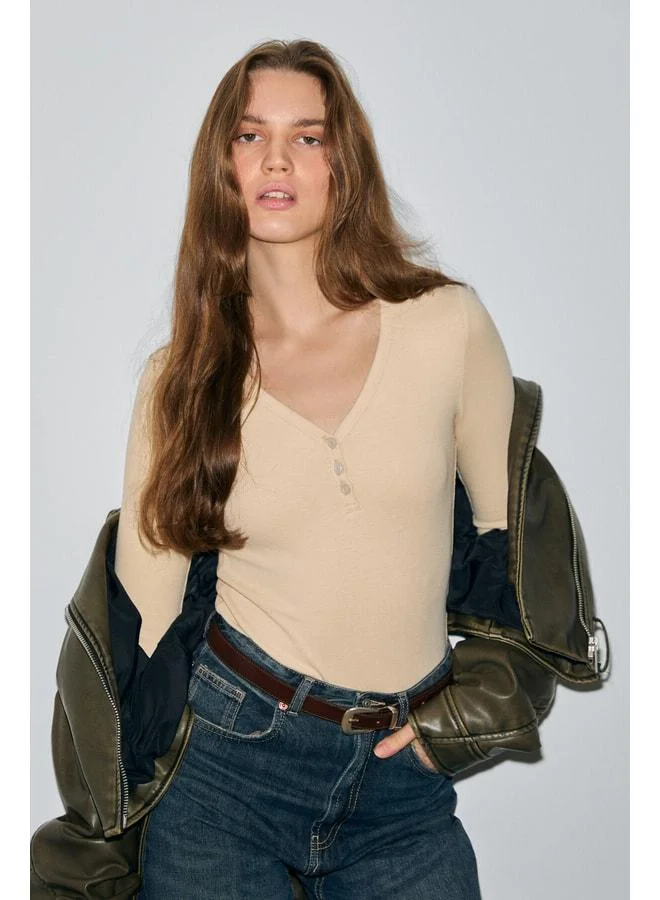 Grimelange KALANI Women's Long Sleeve Snap V-Neck Button-Embellished Beige Blouse.