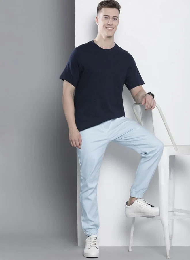 شركة المرآب الهندية Men Slim Fit Solid Mid-Rise Stretchable Chino Joggers