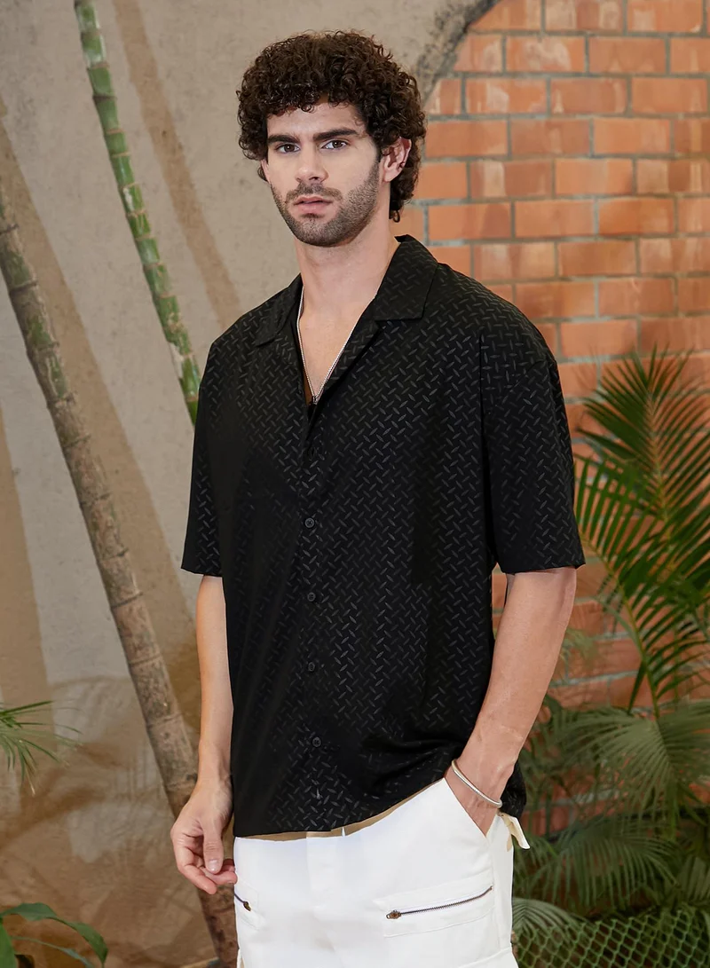 Campus Sutra Campus Sutra Men's Onyx Black Marquise-Imprint Oversized Shirt For Casual Wear | Cuban Collar | Short Regular Sleeves | Button Closure | Oversized Shirt Crafted With Comfort Fit For Everyday Wear