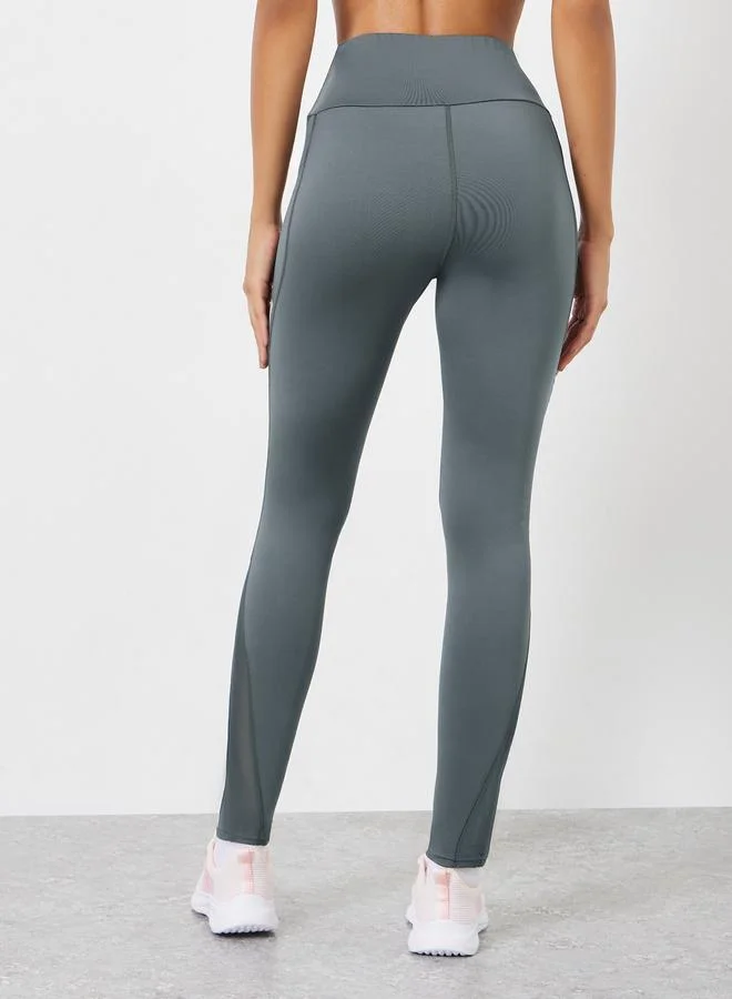 Styli Active Charcoal Reflector Striped Pocket Detail Calf Mesh 7/8 Leggings for Women | Best Price UAE
