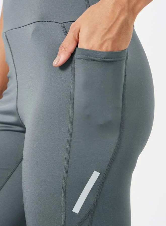 Styli Active Charcoal Reflector Striped Pocket Detail Calf Mesh 7/8 Leggings for Women | Best Price UAE