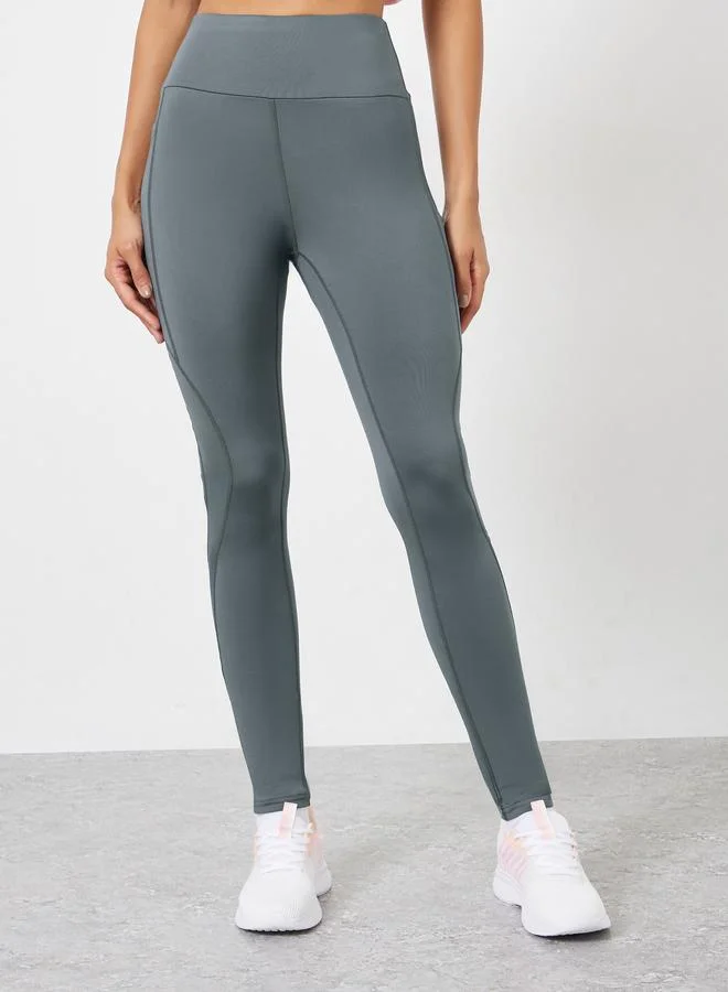 Styli Active Charcoal Reflector Striped Pocket Detail Calf Mesh 7/8 Leggings for Women | Best Price UAE
