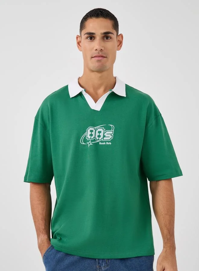 Styli Men Green Graphic Print Oversized Varsity Polo T-Shirt