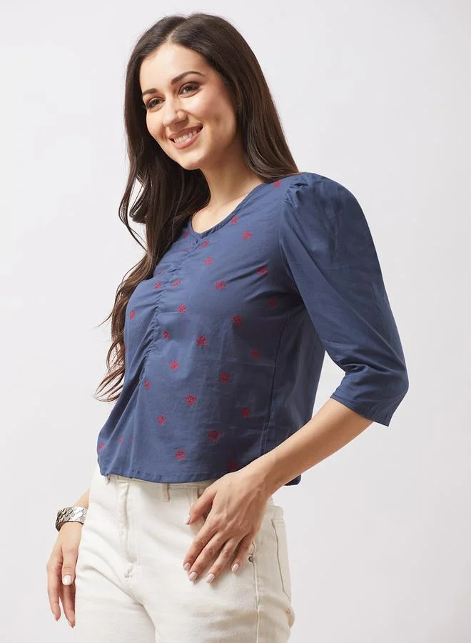 جلو باص بلوزة مطرزة بالزهور بأكمام منفوخة