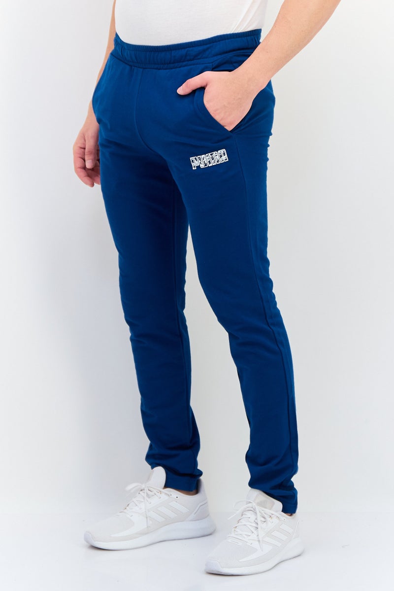 PUMA سروال تدريب ضيق للرجال بشعار العلامة التجارية، أزرق فواتح - Image 2