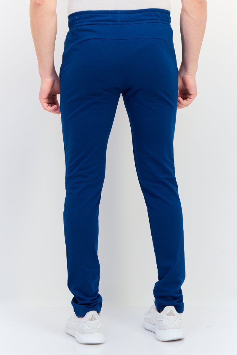 PUMA سروال تدريب ضيق للرجال بشعار العلامة التجارية، أزرق فواتح - Image 3