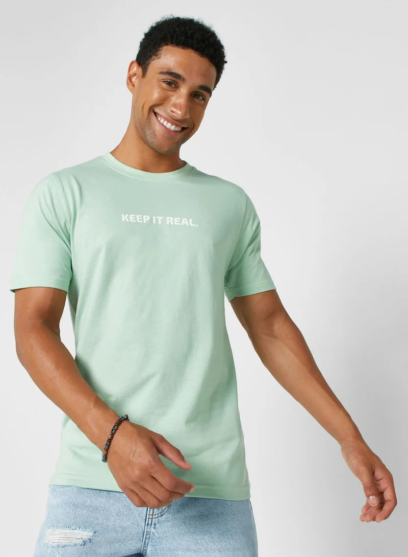 سفنتي فايف تيشيرت بطبعة نصية "Keep It Real"