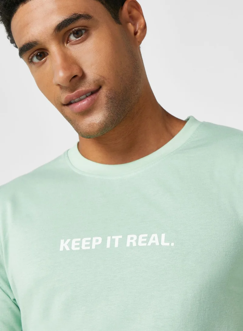 سفنتي فايف تيشيرت بطبعة نصية "Keep It Real"