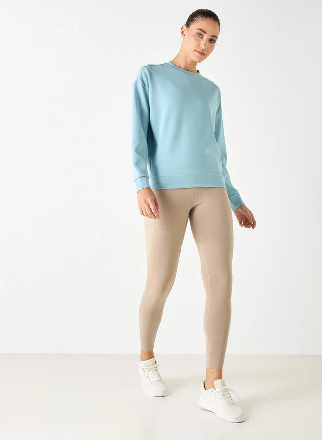 ادوت من سبلاش سويت شيرت بياقة دائرية وأكمام طويلة