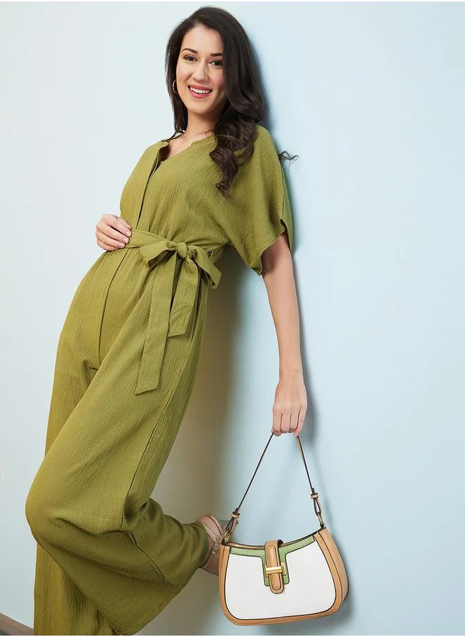 globus Globus Women Green Solid V-Neck Drop Shoulder Waist Tie-Up Jumpsuit by Styli