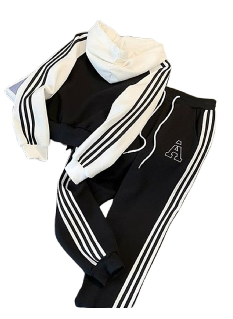 MANIKAN - Jacket a sleek black color with contrasting white sleeves, adorned with three white stripes running down the length of the arms - Image 1