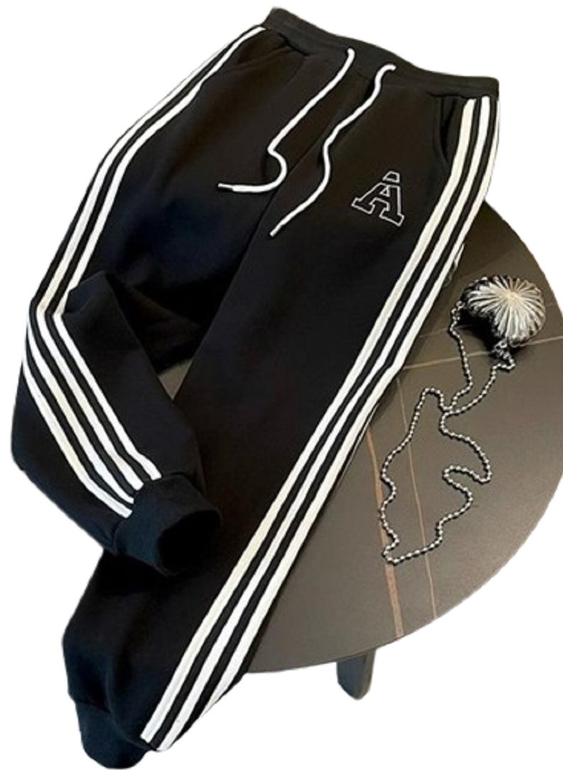 MANIKAN - Jacket a sleek black color with contrasting white sleeves, adorned with three white stripes running down the length of the arms - Image 1
