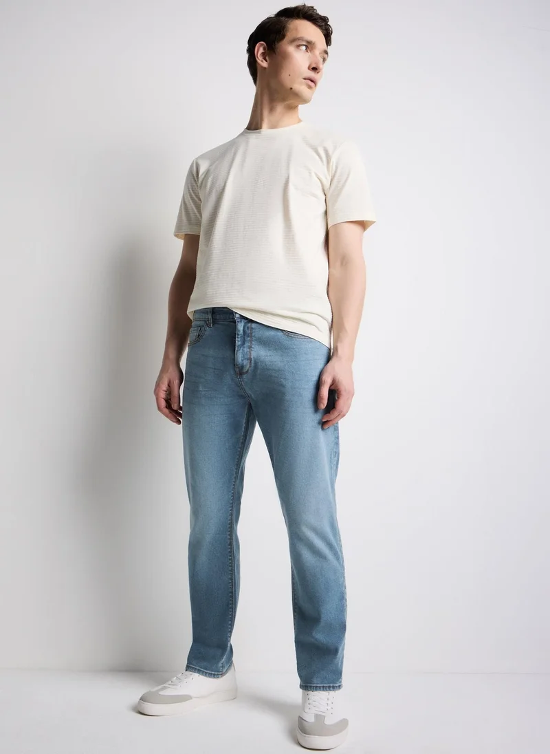 Mid Wash Tapered Fit Jeans Regular