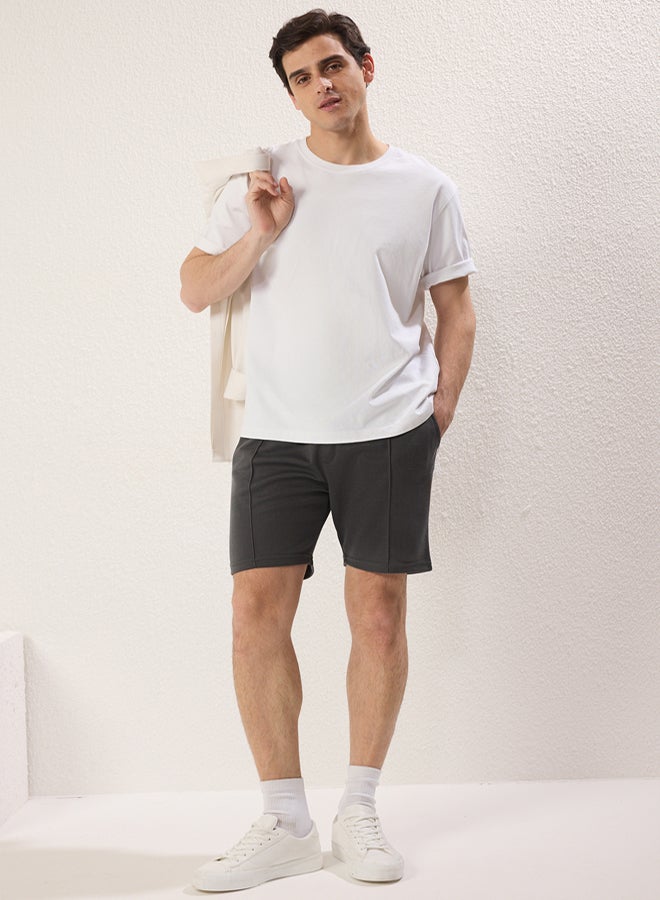 trendyol Regular/Normal Cut Medium Length Textured Elastic Waist Stitching Detail Pique Shorts - Image 1