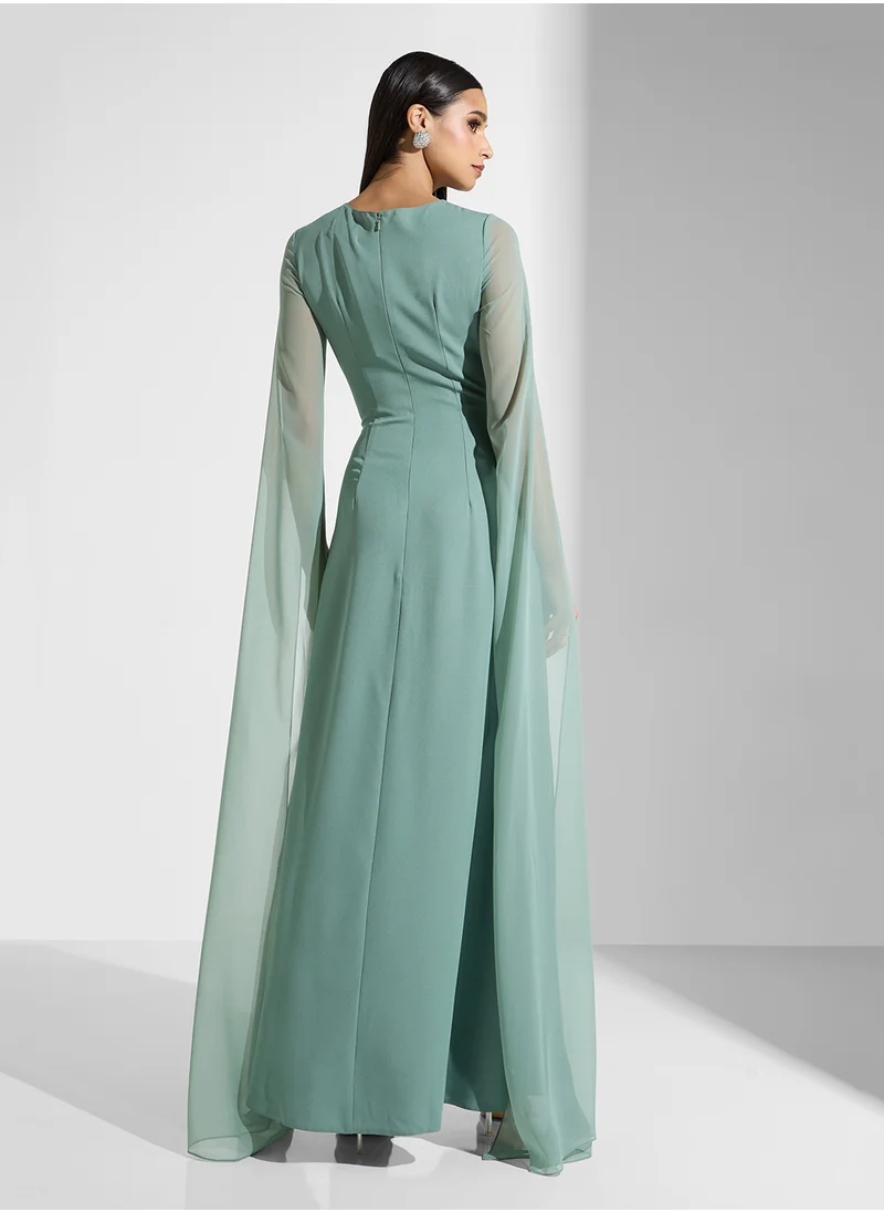 نمشي x Embellished Waist Dress With Exaggerated Slit Sleeve