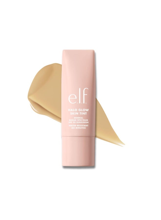 إلف e.l.f. Halo Glow Skin Tint SPF 50، مرطب ملون يوفر تغطية خفيفة وقابلة للبناء، يمنح البشرة إشراقة طبيعية، منتج نباتي ولم يُختبر على الحيوانات، درجة 5 Light Warm، سعة 30 مل. - Image 1