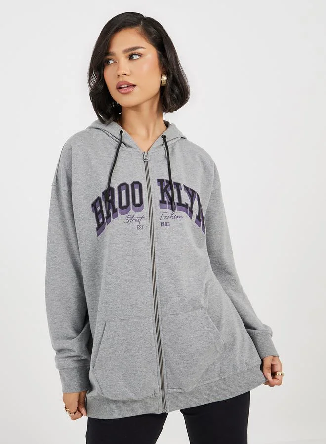 Styli Oversized Longline Zip Through Slogan Hoodie