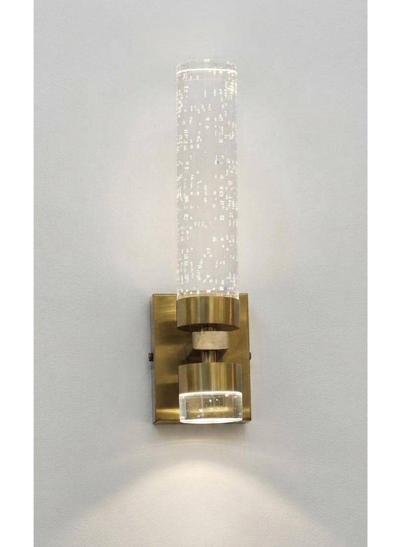 Modern LED wall sconce with a crystal bubble cylinder - a luxurious gold indoor wall lamp for decorative lighting