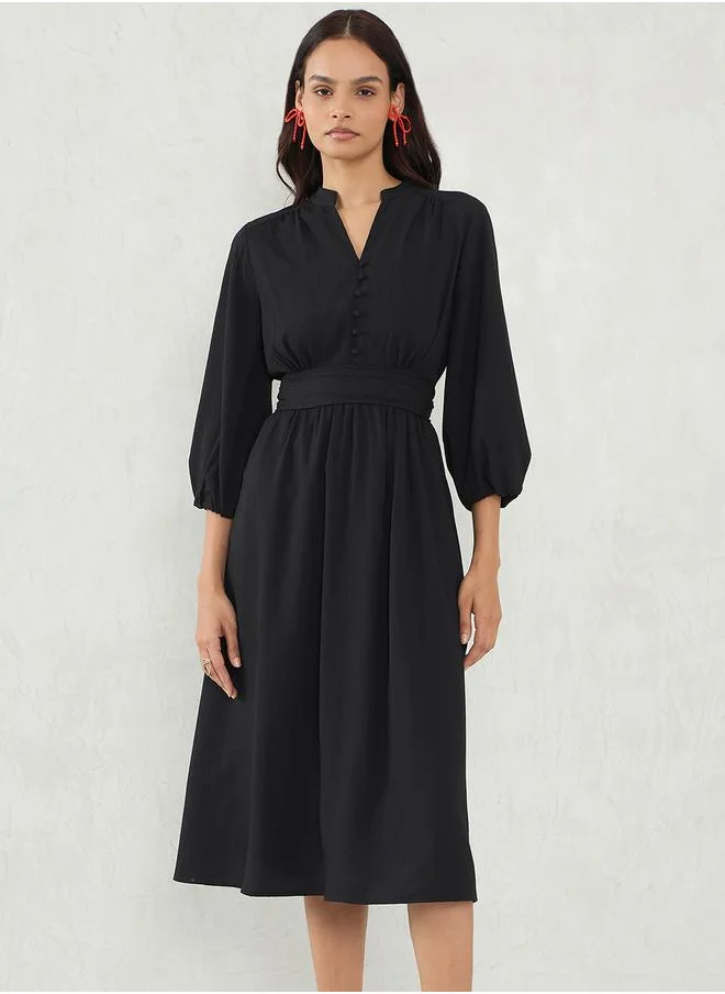 Femmella Solid Cinched Waist A-Line Midi Dress by Styli