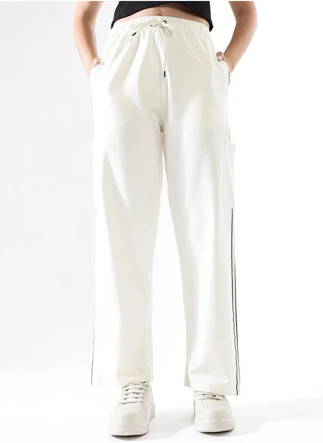 HIGH STAR Women Track Pants in Off White featuring Wide Leg fit with a solid pattern, no sleeves, regular length, secured with elasicated + drawstring closure, crafted from terry – a must-have for those who love trendy fashion.