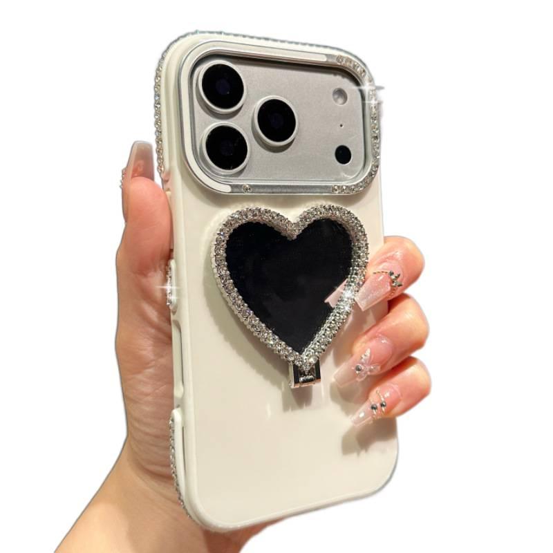 MS غطاء واقي بسيليكون لـ iPhone 16 / 16 Plus / 16 Pro / 16 Pro Max مع إطار عدسة ماسي ومرآة مكياج على شكل قلب مع مقاوم للصدمات مع حامل قائم مع حماية من السقوط باللون برتقالي بوظيفة حا. - Image 2