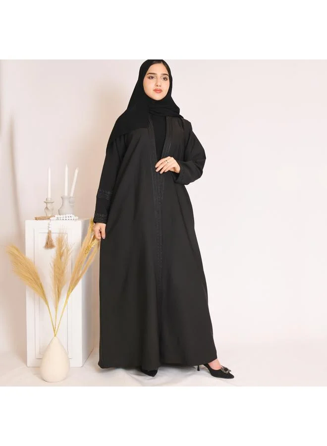HAWRAA ABAYA Black abaya with black embroidery and a pleat at the back