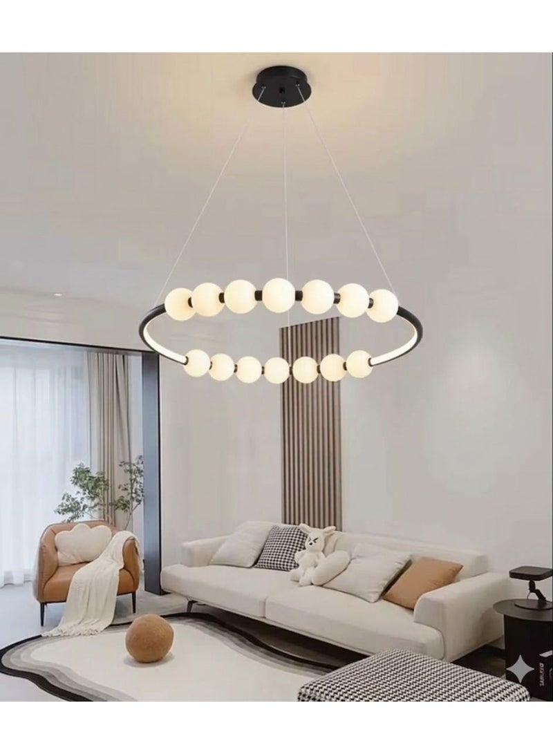 Modern circular ceiling chandelier in black with illuminated glass balls.