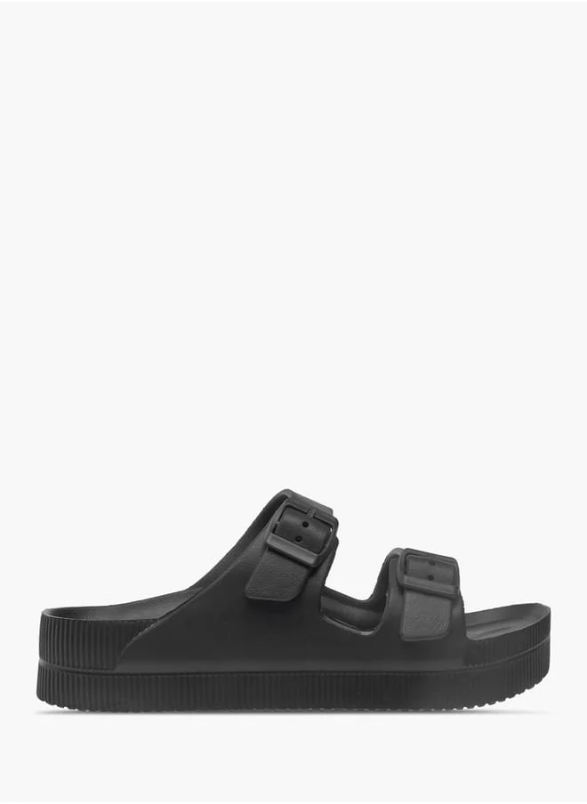 فلورا بيلا من شو إكسبرس Womens Solid Slip-On Sandals With Buckle Accent