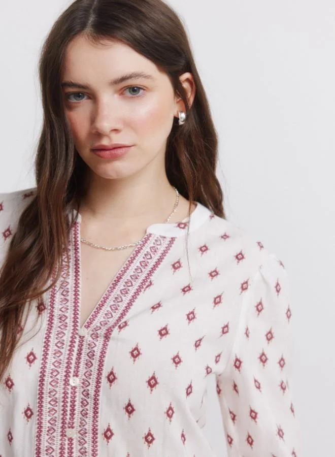 Springfield  Printed voluminous long sleeve shirt. Round neck with V-neck opening. Front buttons. Elasticated cuffs. This garment is made from 100% sustainable cotton. for Women | Best Price UAE